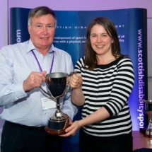 Gordon McCormack OBE receiving the Special Olympics Trophy on behalf of Elaine McKenna